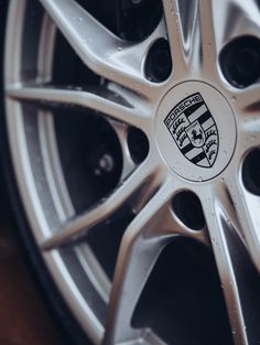 a wheel with the emblem of a car on it