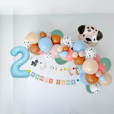 balloons are arranged in the shape of animals and numbers