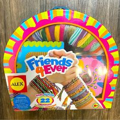 the friends 4 ever bracelets are on display in front of a wooden background with an advertisement