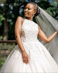 a woman wearing a wedding dress and veil