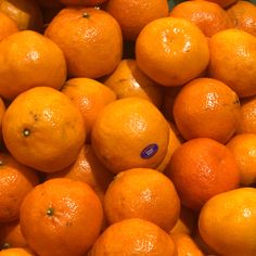 a pile of oranges sitting next to each other