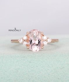 an oval pink morganite and diamond ring