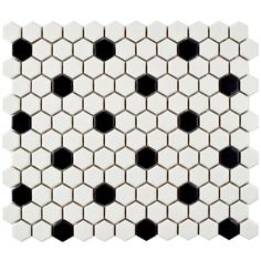 the white and black hexagonal tiles are arranged in an irregular pattern, making it appear to be very interesting