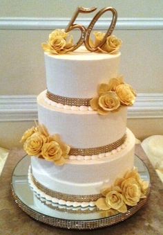 a white cake with yellow flowers on top