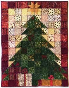 a quilted christmas tree with presents on it