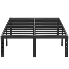 a black metal bed frame with four legs