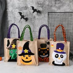 three bags with halloween decorations on them