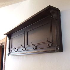 the coat rack is mounted on the wall