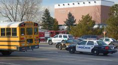 a school bus and police cars on the street