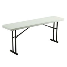 a white table with black legs on a white background