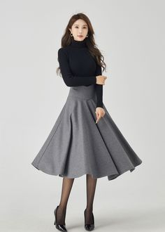 "Elevate your winter wardrobe with our deep gray wool midi skirt featuring a stylish V-shaped waist.The sophisticated gray hue exudes elegance, while the premium wool fabric ensures both style and warmth. The thoughtfully designed buttons add a touch of refinement to your ensemble. This versatile midi skirt effortlessly transitions from day to night, making it a must-have choice for those who seek both fashion and coziness. DETAILS * 30% wool, 30% fiber, 40% polyester * Fully satiny liner * Without pockets * Back zipper closure * Pleated Circle skirt * Below knee length skirt * Perfect for Winter, autumn MODEL SIZE Bust 85 cm(33.4\") Waist 67 cm(26.7\") Height 168cm (5' 6\") She wears size XS Choose CUSTOM Order if you * Need a better fit * Can't find your size in our size Chart * Chang th Midi Skirt Winter, Custom Skirt, Long Wool Skirt, Solid Skirt, Skirt Pleated, Wool Clothing, Winter Skirt, Wool Skirt, Skirt Women