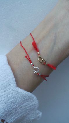 This simple red string bracelet makes a great gift. D E T A I L S *Made with a pure silk cord that has been twisted for strength. (Cord is 0.7mm thick). *Choose between sterling silver,  gold filled or rose gold filled components. *S I Z I N G H E L P: This bracelet works best with a snug fit. So measure you wrist exactly and to this add 1/2 an inch to account for flex. P A C K A G I N G: All our products are gift ready. T E R M S* O F* S A L E S & F A Q https://etsy.me/2PuWBv6 F O L L O W Instagram: @Allaboutevecreations and  Facebook: www.facebook.com/AllAboutEveCreations Pinterest: www.pinterest.com/allaboutevecreations Red String Of Fate Bracelet, String Of Fate, Red String Of Fate, How To Make Red, Kabbalah Bracelet, Braided Bracelet Diy, Braided Rope Bracelet, Pretty Jewelry Necklaces, Red String Bracelet