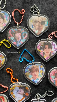 several heart shaped necklaces with pictures on them