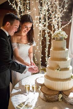 a bride and groom cutting their wedding cake