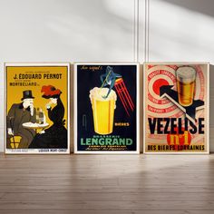 three posters with different types of beer on them in an empty room next to a wooden floor