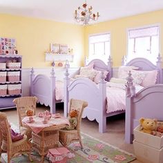 a child's bedroom with yellow walls and purple furniture