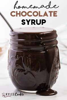 chocolate syrup in a mason jar with the words homemade chocolate syrup on it and an image of