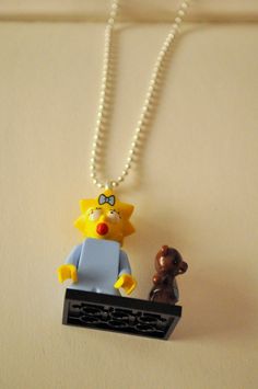 #Necklace with Maggie Simpson #LEGO pendant by RiciclAr on Etsy Maggie Simpson, Pendant Necklace, Handmade Gift, Pendant, Trending Outfits, Unique Jewelry, Handmade Gifts