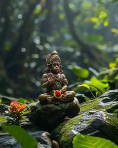 a statue sitting on top of a moss covered rock