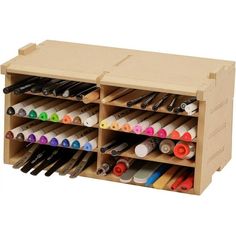 a wooden box filled with lots of art supplies