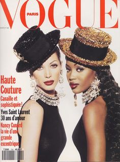 two women wearing hats on the cover of a magazine