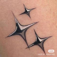 three black and white stars on the thigh