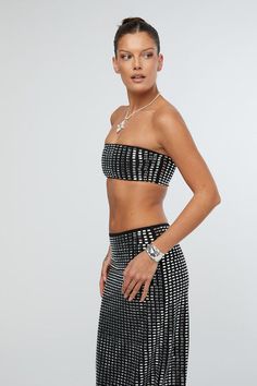 Turn heads and exude glamour in the Geo Crystal Bandeau Top Black, a dazzling masterpiece from We Wore What. This exquisite bandeau top features a captivating all-over geo crystal design that catches the light, creating a mesmerizing display of... We Wore What, Fall Forward, Midi Skirt Black, Crystal Design, Black Midi Skirt, Fitted Silhouette, Bandeau Top, Skirt Black, We Wear