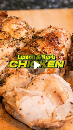 lemon and herb chicken on a cutting board with the words, lemon and herb chicken