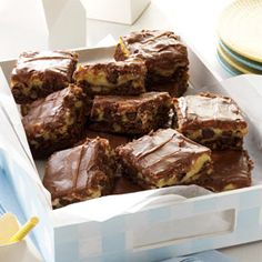 a box filled with brownies sitting on top of a table