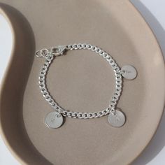 Make a unique statement with our Carter Personalized Disc Bracelet! This cool, customizable sterling silver bracelet features a disc charm with your choice of initials. Perfect as a gift or for treating yourself to something special. DETAILSSterling SilverBracelet Sizing: XS= 5.5", S=6", M=6.5", L=7", XL=7.5" with a .5" adjustable spring hook claspHypoallergenic, waterproof and nickel free To measure your wrist size, wrap a piece of string around your wrist the way you would like the bracelet to Gold Jewelry Gift, Disc Bracelet, Modern Muse, Forever Jewelry, Initial Bracelet, Solid Gold Jewelry, Hook Clasp, 5 S, Sterling Silver Bracelet