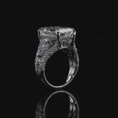 a diamond ring on a black background