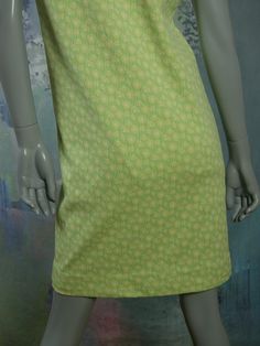 This 1960s Swedish vintage shift dress has a delicate yellow floral pattern on a mint green background. The sleeveless slip-on dress has a square bateau neckline and a green polyester lining. Bust = 37 inches (93.98cm) Waist = 37 inches (93.98cm) Hips = 37 inches (93.98cm) Dress Length = 35.5 inches (90.17cm) Brand label: Ajco (Made in Sweden) Size: 6/8 US/UK Material: Diolen Polyester Condition: Excellent (clean, soft, and supple, with no stains, tears, wear spots, or weaknesses in the seams) - Green Spring Dress With Straight Neckline, Green Stretch Dresses With Square Neck, Green Stretch Square Neck Dresses, Green Square Neck Stretch Dresses, Green Square Neck Daywear Dress, Green Square Neck Dress For Daywear, Green Knee-length Mod Dress, Green Mod Knee-length Dress, Vintage Green Square Neck Dress