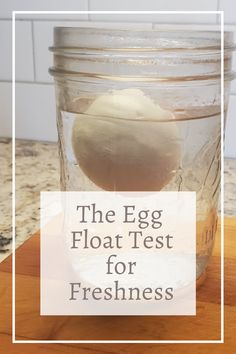 the egg floatt test for freshness is in a glass jar on a counter