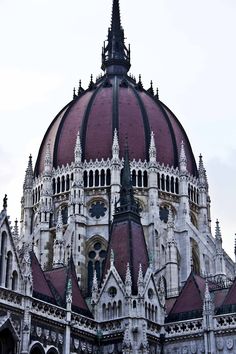 an ornate building with a clock on the top