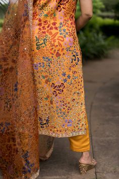 Yellow kurta with abstract print and sequin embroidery. Paired with pant and dupatta.
Component: 3
Pattern: Printed, Embroidery
Type Of Work: Abstract, sequin
Neckline: Scoop neck
Sleeve Type: Sleeveless
Fabric: Imported Satin, Bemberg Satin, Organza
Color: Yellow
Other Details: 
Embroidered neckline
Sheer printed dupatta
Note: Clutch shown in the image is not for sale
Occasion: Reception - Aza Fashions Festive Multicolor Embroidered Sequined Sets, Festive Multicolor Embroidery Sequined Sets, Festive Sets With Multicolor Embroidery And Sequins, Festive Multicolor Traditional Wear With Sequins, Multicolor Sequined Dupatta In Traditional Drape, Traditional Draped Multicolor Sequined Dupatta, Traditional Multicolor Sequined Dupatta, Summer Traditional Wear With Printed Motifs For Designer Occasions, Summer Multicolor Unstitched Suit With Resham Embroidery