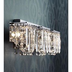 a crystal wall light on the side of a wall