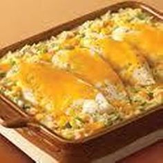 a casserole dish with chicken and cheese on top