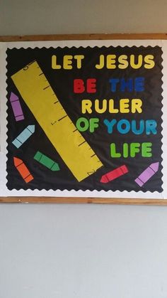 a bulletin board that says let jesus be the ruler of your life with crayons