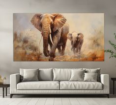 an elephant painting hanging on the wall in a living room with a couch and coffee table