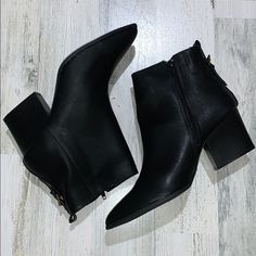 These Classic Black Booties Bring Any Dress Or Casual Outfit Together! Black Faux Leather Boots With Low Heel, Black Low Heel Boots With Buckle Closure, Black Heeled Boots With Buckle For Work, Black Ankle Boots With Buckle Closure, Black Booties With Buckle Closure For Fall, Black Heeled Boots With Ankle Strap For Fall, Black Ankle Strap Heeled Boots For Fall, Fall Black Heeled Boots With Buckle Closure, Black Boots With Buckle Closure And Pointed Toe