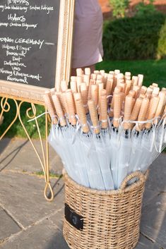 a basket full of wooden sticks sitting on top of a table