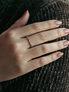 This ring features an eternity braided band with an intricate series of compliments to the delicate foxtail lily. Wear stacked or as a wedding band, this whimsical piece is perfect for any purpose. Elegant Twisted Wedding Ring, Classic Stackable 14k Rose Gold Rings, Modern Twist Stackable Rings For Promise, Modern Twist Stackable Twisted Promise Rings, Elegant Twisted Stackable Rings As Gift, Modern Twist Rose Gold Stackable Rings For Wedding, Modern Twist Rose Gold Stackable Wedding Rings, Stackable Twisted Rings For Promise, Elegant Twisted Promise Rings