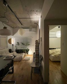 a room with wooden floors and white walls