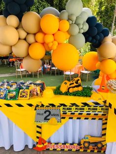 a construction themed birthday party with balloons and decorations