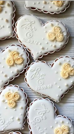 decorated cookies in the shape of hearts on a table