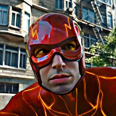 a man in a red flash suit and goggles