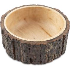 a wooden bowl that is made out of tree trunks and has been cut in half