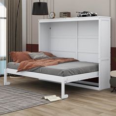 a white bed frame with an open headboard and foot board on the bottom shelf