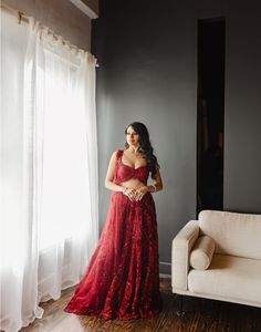 Featuring Reverie, a beautiful maroon, hand-embroidered lehenga embroidered with beads, sequins, and stones. It is paired with a uniquely crafted blouse and cape dupatta. DELIVERY TIMEPlease allow 12-16 weeks for your outfit to arrive. FABRIC DETAILSNet Professional cleaning only. Red Wedding Saree With Intricate Embroidery, Red Wedding Pre-draped Saree With Intricate Embroidery, Designer Red Pre-draped Saree With Sequins, Elegant Red Lehenga With Sequins, Elegant Red Gown With Mirror Work, Red Sequined Anarkali Choli, Red Sequined Anarkali Set, Red Anarkali Choli With Sequins, Red Lehenga With Sequins And Traditional Drape