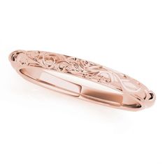 a rose gold wedding band with an intricate design